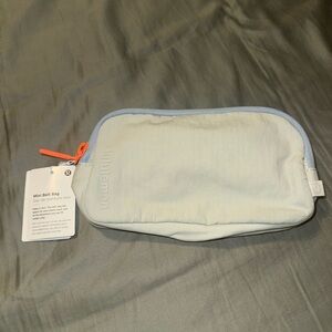 Mini Lululemon Athletica Light Blue Crossbody Bag with Orange Zipper